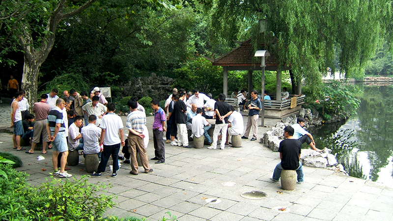 Local people play Chinese chess in People's Square
