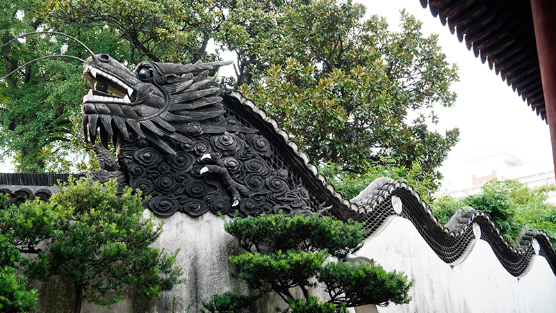 Stone dragon sculpture on the top of a building